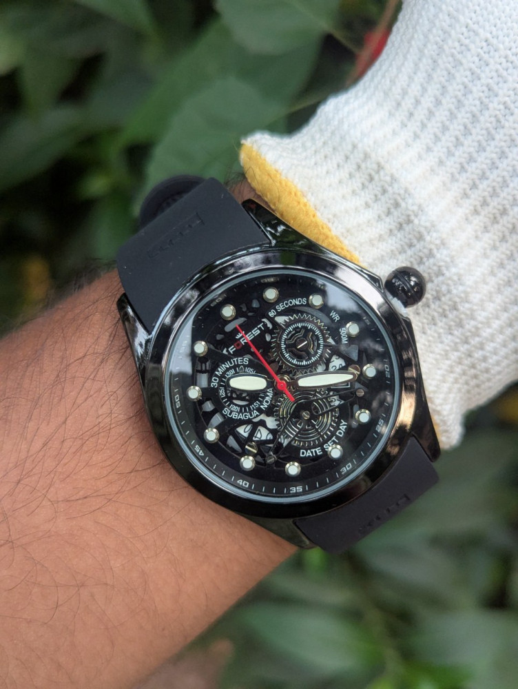 Embrace natural elegance with the Forest Metal Case Analog Watch