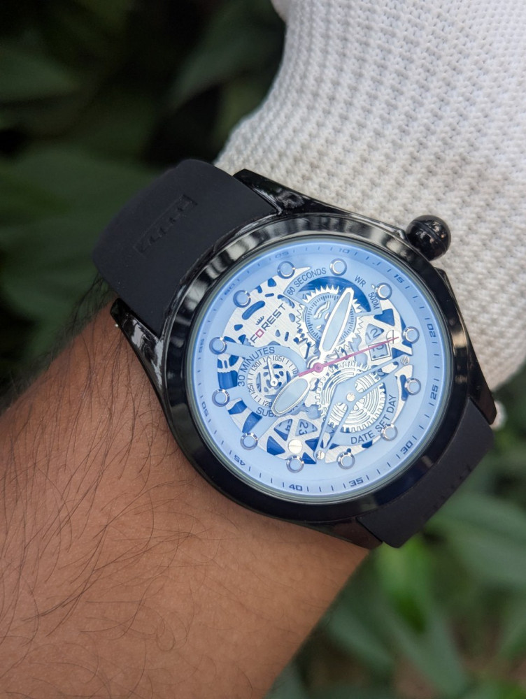 Embrace natural elegance with the Forest Metal Case Analog Watch