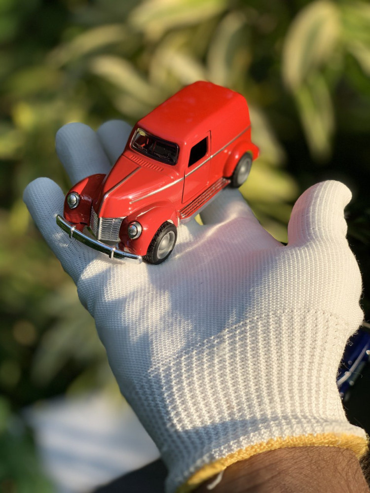 Step back in time with this 1:43 scale Ford sedan delivery Vintage metal car